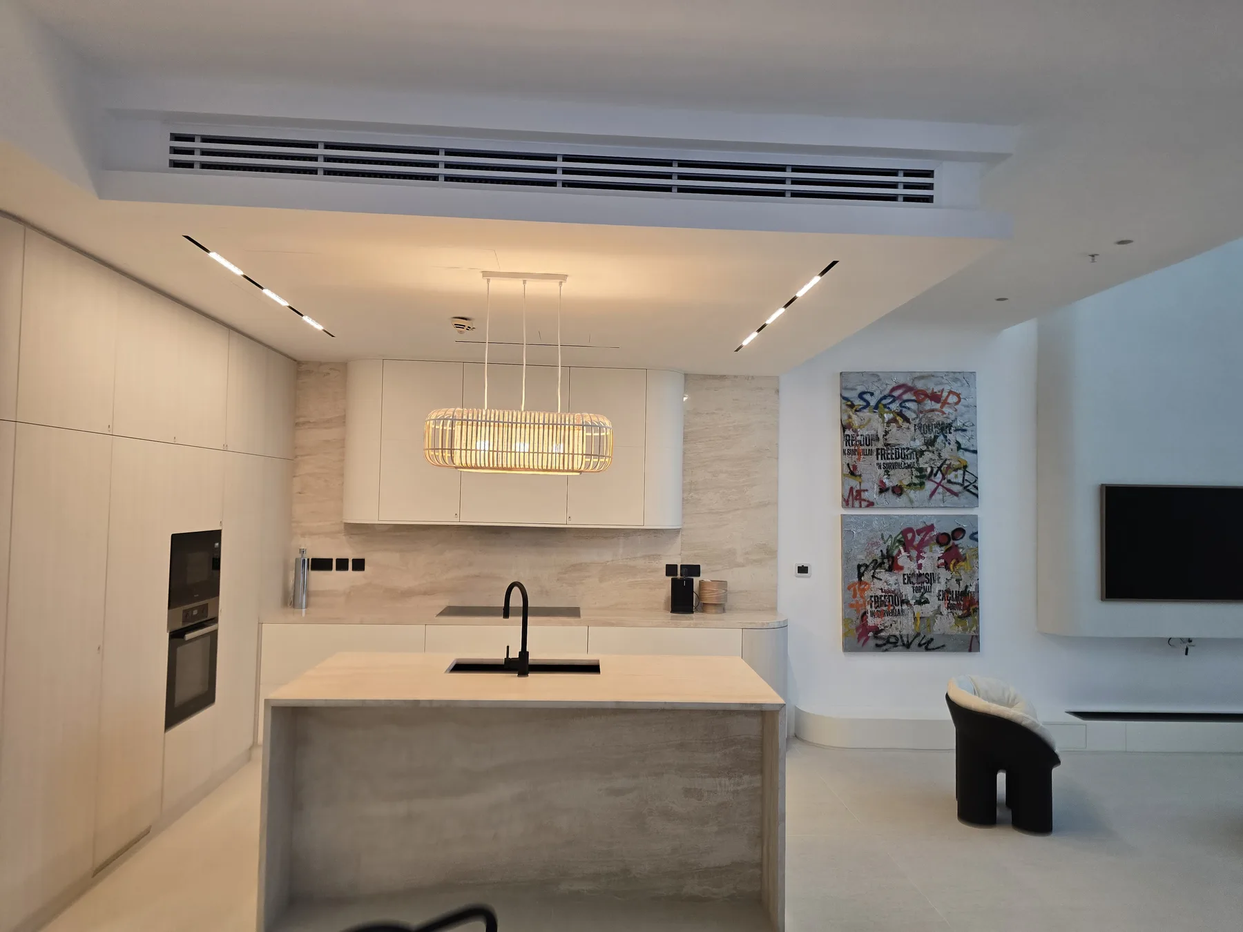DIFC apartment after renovation. Minimal luxury with light colors, clean finishes and elegant art.